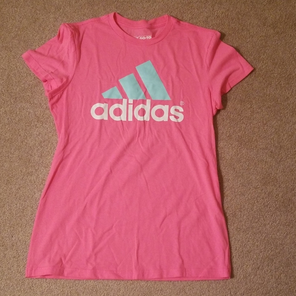 Pink adidas exercise shirt with green logo